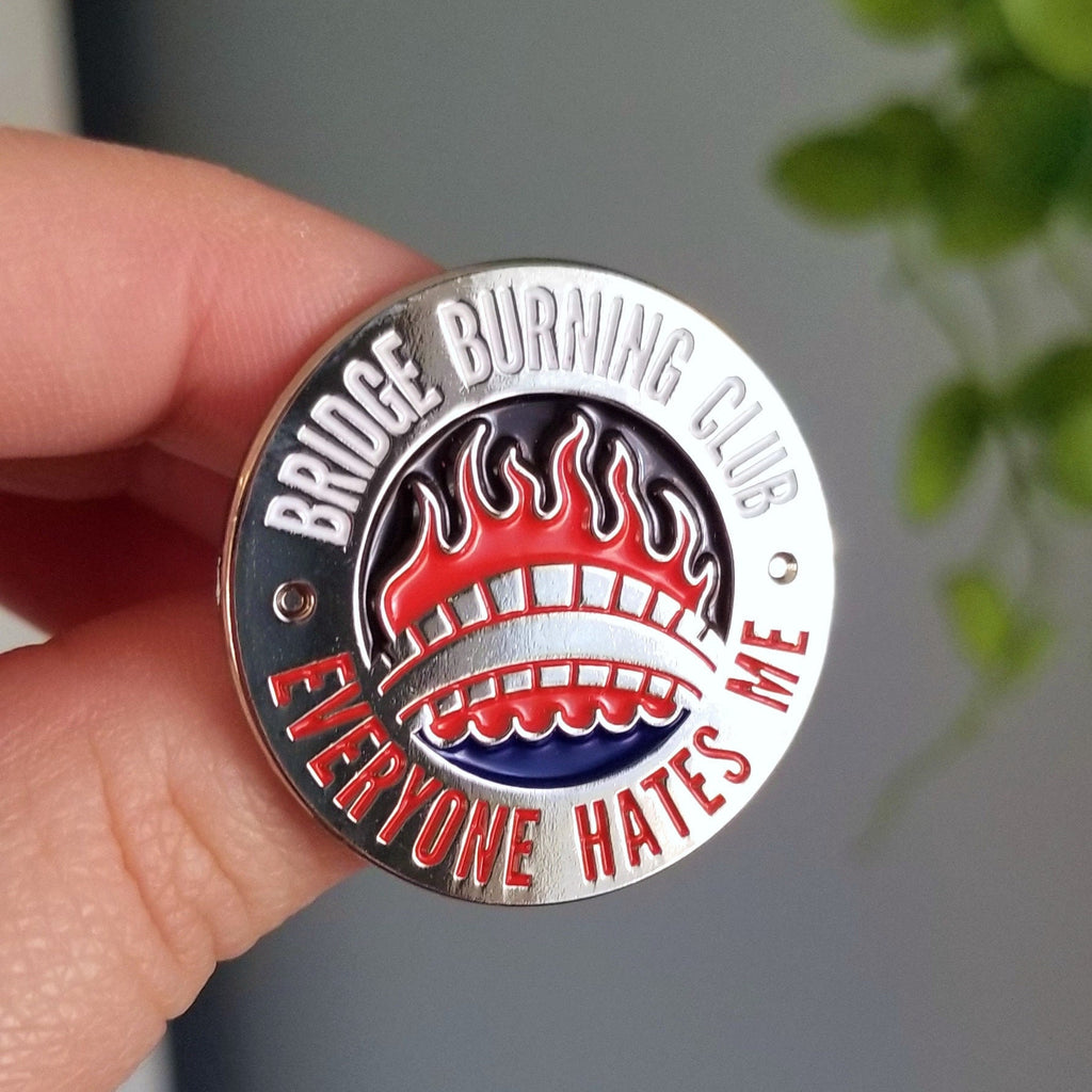 Bridge Burning Club Enamel Pin: Offbeat Silver Badge - Cosmic Buns Art