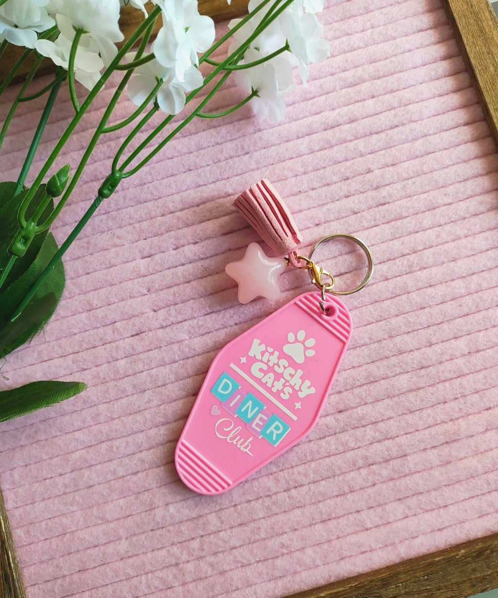 Retro Diner Hotel Keychain: Kitschy Cat's Cosmic Buns Art with Charms